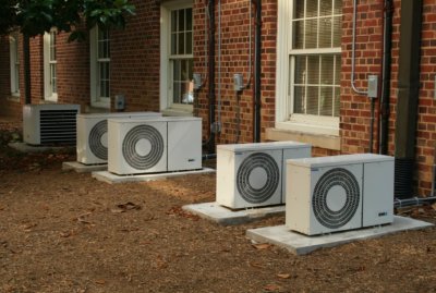 Air conditioning units outside of red brick building